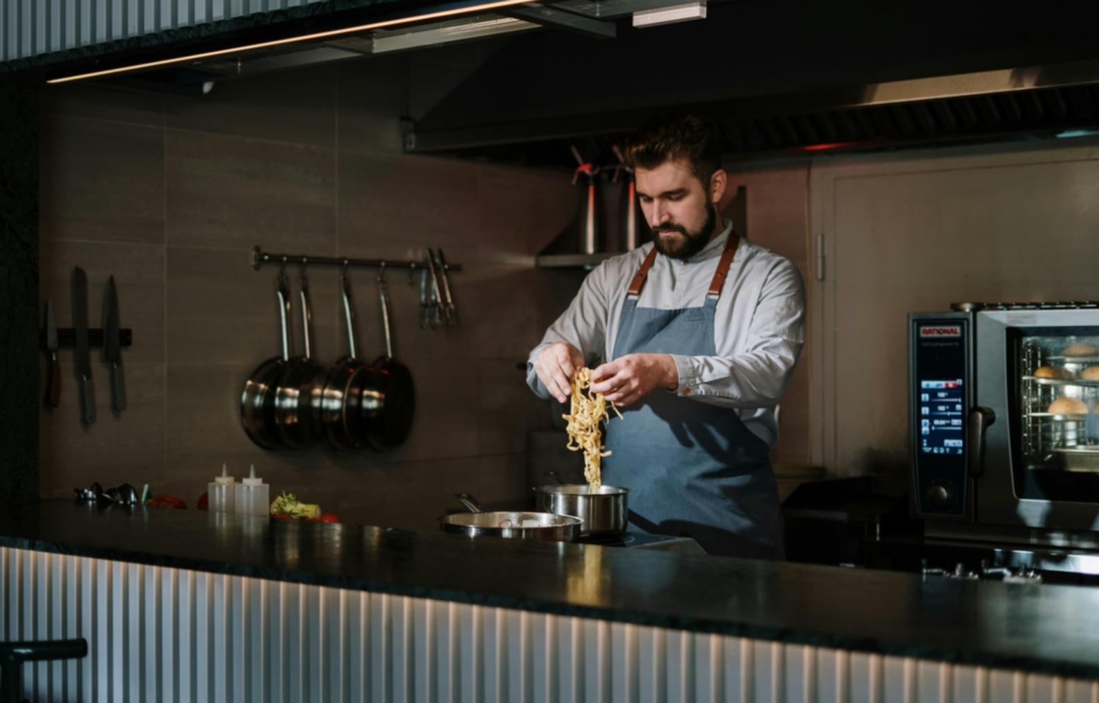 Live cooking demonstration showing hands-on plant-based preparation techniques